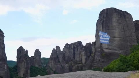 Greek Flag Blowing in the Wind Slow Motion on a Hill in Meteora, Greece. Vi.. Stock Footage 334897261