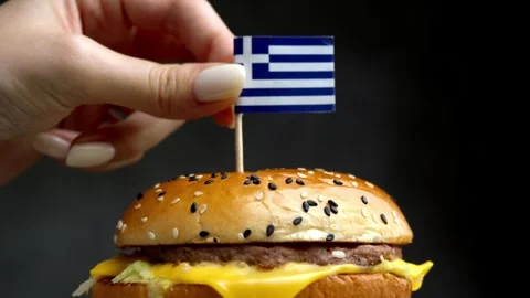 Greek flag on burger, reference to local Greek farms. Stock Footage 323010354