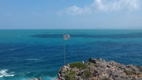 Greek flag floating over windy sea Stock Footage 254332849