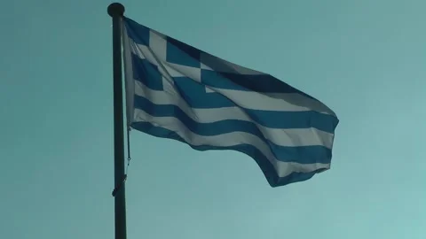 A Greek flag is fluttering in the wind Видео 343389273