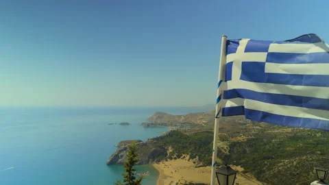 Greek Flag Waving in Slow Motion Above Rhodes Island Mediterranean Coast Stock Footage 344579874