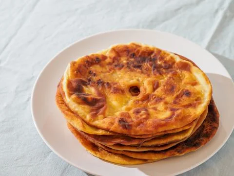 Greek flatbread on the plate. Stock Photos