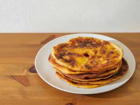 Greek flatbread on the plate. Stock Photos