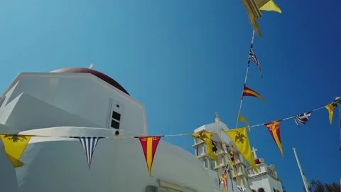Greek Orthodox flags during Easter at church in Mykonos, Greece Stock Footage 238795709