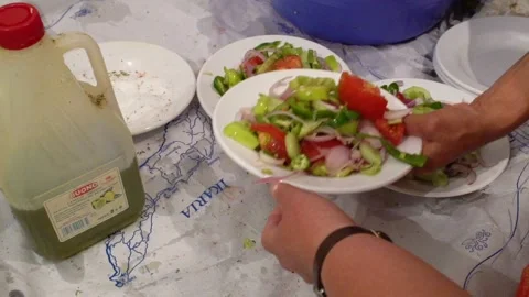 Greek salad adding salt and olive oil  Stock Footage 144484601