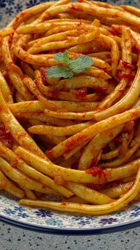 Greek stewed string beans with tomatoes and olive oil. Vertical video. Stock Footage 283140085