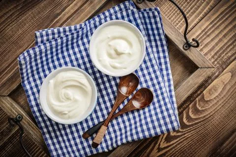 Greek yogurt in bowls Stock Photos