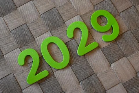 Green 2029 numerals on woven surface 스톡 사진