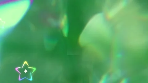 Green abstract background with glowing iridescent star shapes floating through Vídeos de archivo 343847972