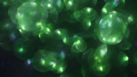 Green abstract flashing background. blurred lights Stock Footage 81582422