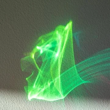 Green abstract light wave on textured wall with neon motion and energy Stock Photos