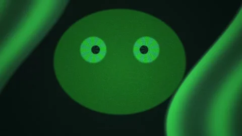 Green alien face with glowing eyes in dark background. Stock Footage 336701635