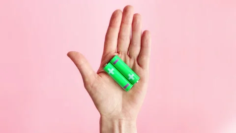 Green alkaline batteries AA type rechargeable accumulators Stock Footage 235470822