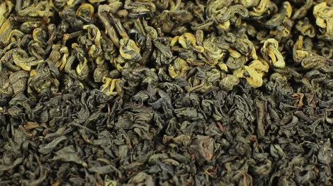 Green and black tea background mix and close up rotation Video stock 53788066