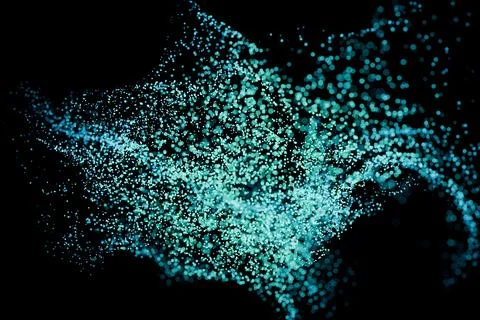 Green and blue particles float on a dark background. Stock Photos