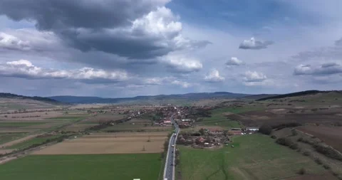 Green and brown rural fields with blue sky in the summertime in Romania Stock Footage 201489888