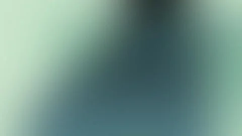 Green and gray blurred gradient background with soft light. Seamless loop in 4K Vídeo Stock 309855547