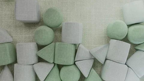 Green and Gray Pillows in Various Shapes Falling Stock Footage 310823153