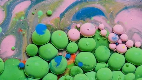 Green and pink inks react to form a beautiful structure of paint bubbles. Stock Footage 121222995