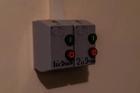 Green and red button on the wall Stock Photos