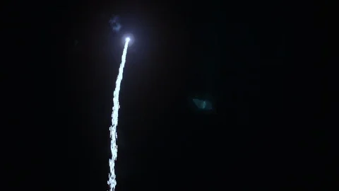 Green and Red Fireworks Exploding in Night Sky TILT UP Video stock 107277052