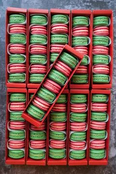Green and red Macaron in red boxes Stock Photos