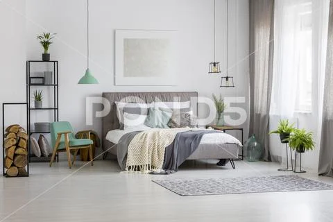 Green and silver spacious bedroom Stock Photos