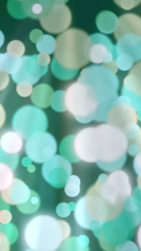 Green and Teal Bokeh Lights Glowing Circles Vertical Seamless Loop Video stock 345853135