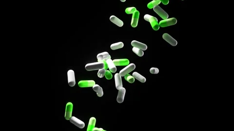 Green and white capsules float in 3D against a dark background, highlighting a Stock Footage 267144243