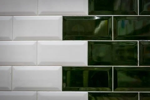 Green and white ceramic bricks on the wall Stock Photos