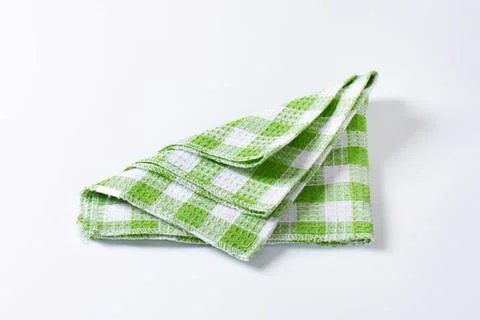 Green and white checkered folded cloth napkin 스톡 사진