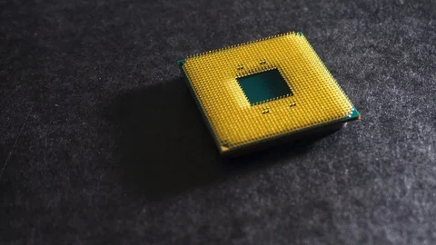 Green and yellow central processing unit (CPU), slow pan, wide close up Stock Footage 130093043