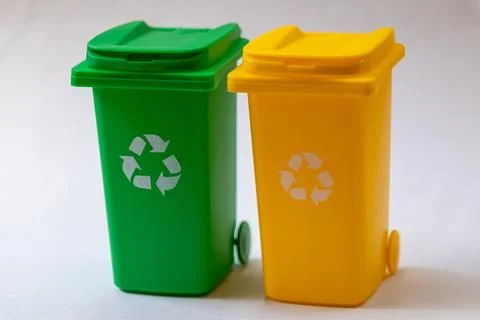 Green and yellow recycling bins isolated on white background 스톡 사진