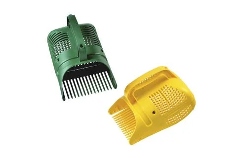 Green and yellow scoop for picking berries, special scoop for accelerating th Stock Photos