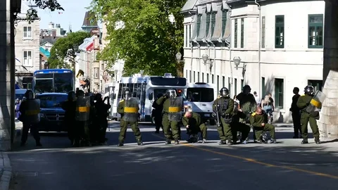 Green anti-riot cops blocking street Stock Footage 95266611