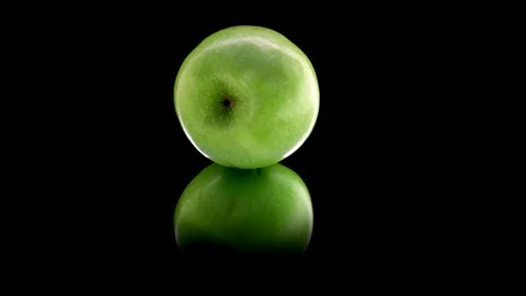 Green Apple against black. Looping Stock Footage 89310946