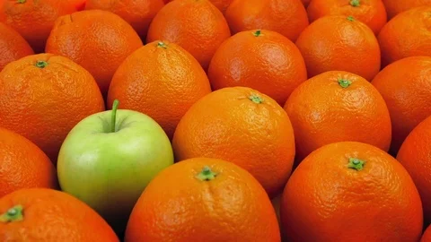 Green Apple Among Oranges - Odd One Out Concept Stock Footage 84956113