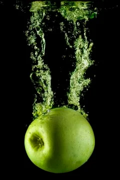 Green apple and bubbles. Stock Photos