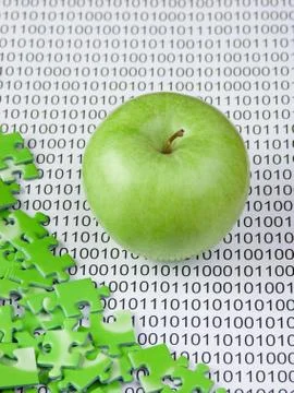 Green apple and puzzles on a binary code Foto stock