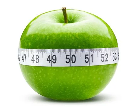 Green apple and soft or flexible tape measure for sewing tailor cloth ruler Stock Photos