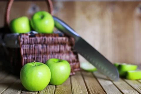 Green apple in a basket Stock Photos