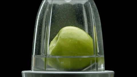 A green apple being blended Stock Footage 128722482
