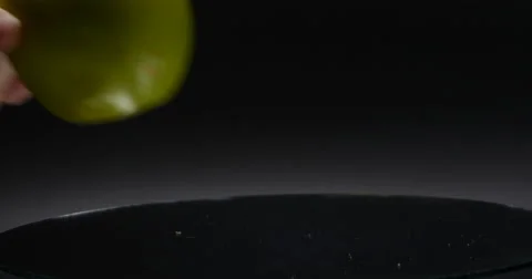 Green Apple Being Placed on Rotating Mirror Isolated on Black, 4K Stock Footage 66297737