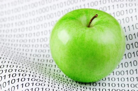 Green apple on a binary code Stock Photos