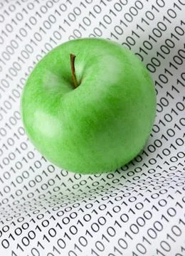 Green apple on a binary code Foto stock