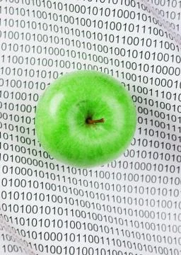 Green apple on a binary code 库存照片