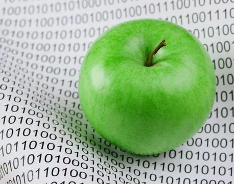 Green apple on a binary code Stockfoto's