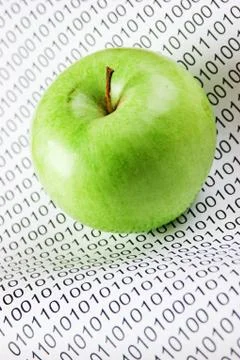 Green apple on a binary code Stock Photos