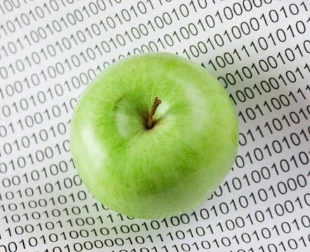 Green apple on a binary code Stock Photos