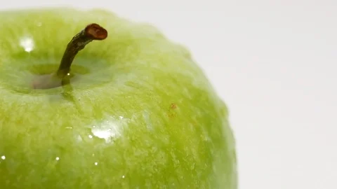 Green apple closeup cropped, splashed with drops of water Stock Footage 99262771